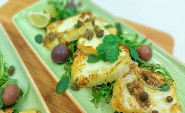 Fried halloumi cheese salad with caper herb and lime dressing